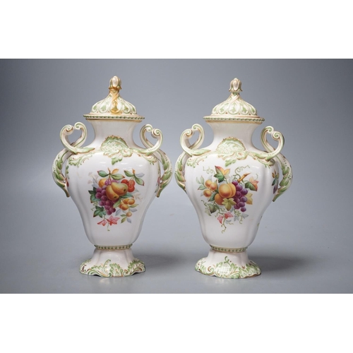 1258 - A pair of Copelands London, fruit decorated two handled vases and covers, circa 1900- 20cms high.... 