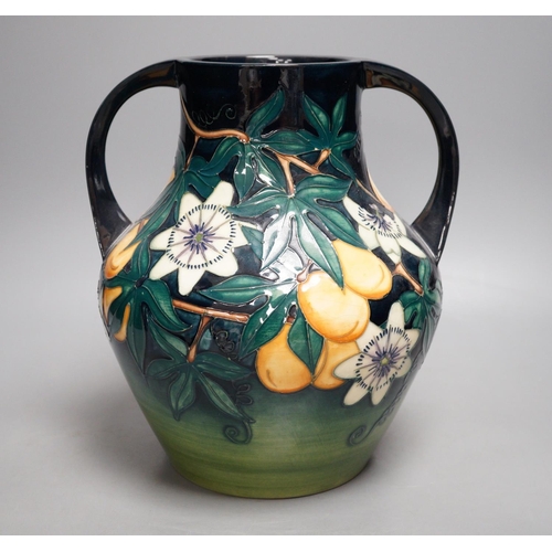 1270 - A Moorcroft pottery two handled vase, decorated with the "Passion flower" pattern, designe... 