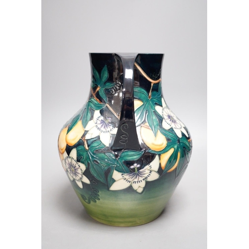 1270 - A Moorcroft pottery two handled vase, decorated with the "Passion flower" pattern, designe... 