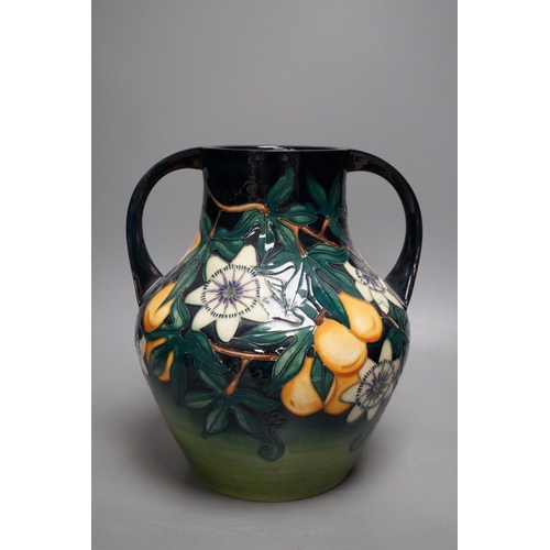 1270 - A Moorcroft pottery two handled vase, decorated with the "Passion flower" pattern, designe... 