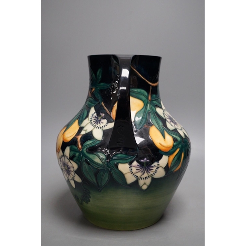 1270 - A Moorcroft pottery two handled vase, decorated with the "Passion flower" pattern, designe... 