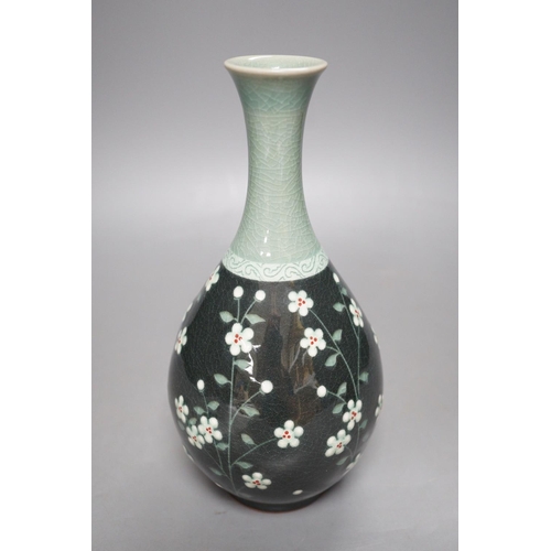 1276 - A Korean celadon ground floral decorated bottle vase, 20.5cm