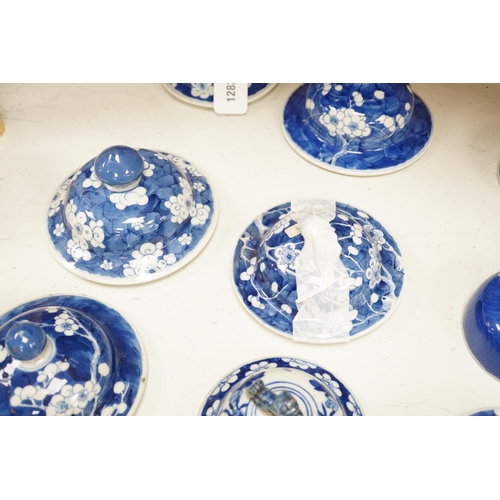 1283 - Twelve 18th/19th century Chinese blue and white prunus vase and jar covers, largest 17 cm diameter... 