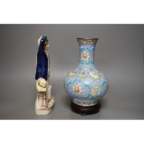 1284 - A Chinese canton enamel vase, wood stand, 23.5cm tall