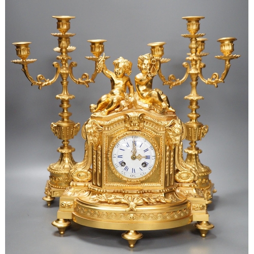 1289 - A Louis XVI style ormolu cherub clock garniture, late 19th century, with pendulum, 43cm tall... 