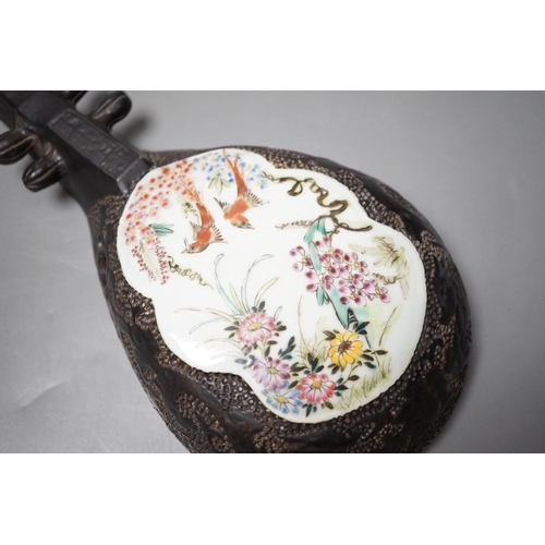 1292 - A Chinese wall model of a musical string instrument (Pipa?) with painted porcelain inset, 27cm long... 