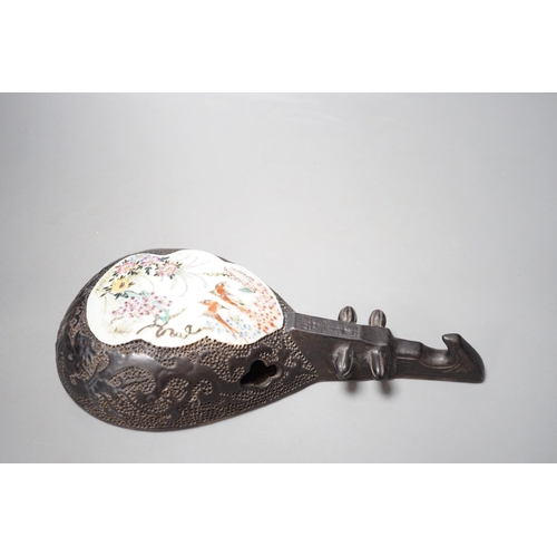 1292 - A Chinese wall model of a musical string instrument (Pipa?) with painted porcelain inset, 27cm long... 