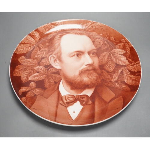 1296 - A late 19th century art pottery handpainted portrait dish, 36cm diameter