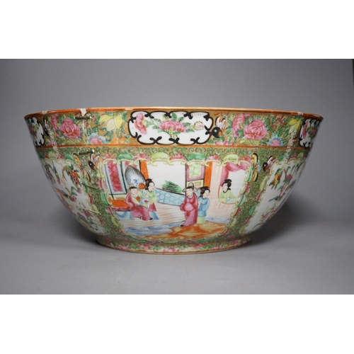 1300 - A 19th century Chinese famille rose punch bowl, painted with figures, 34.5 cm diameter, repaired... 