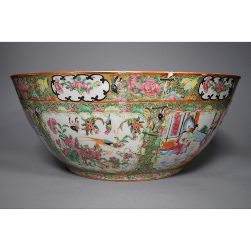 1300 - A 19th century Chinese famille rose punch bowl, painted with figures, 34.5 cm diameter, repaired... 