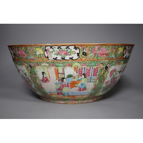 1300 - A 19th century Chinese famille rose punch bowl, painted with figures, 34.5 cm diameter, repaired... 