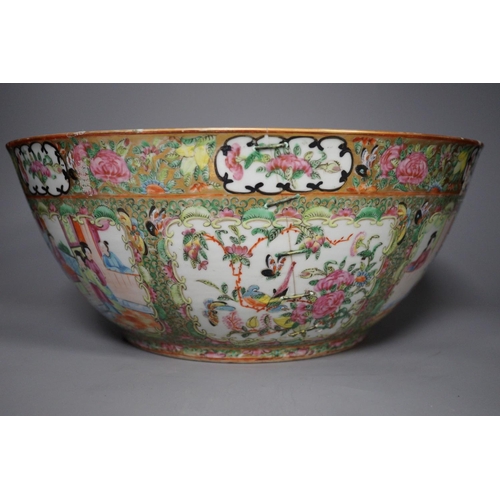 1300 - A 19th century Chinese famille rose punch bowl, painted with figures, 34.5 cm diameter, repaired... 