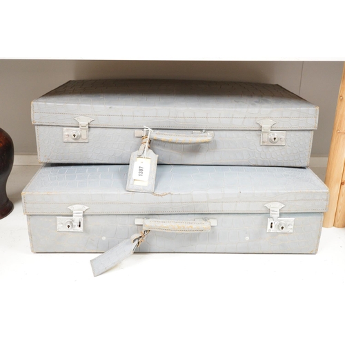 1307 - A pair of blue/grey faux crocodile suitcases