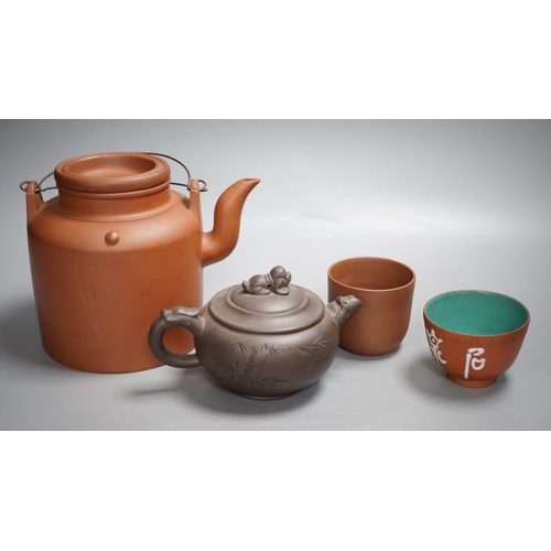 1315 - Two Chinese Yixing teapots and two similar teabowls. Tallest 14cm