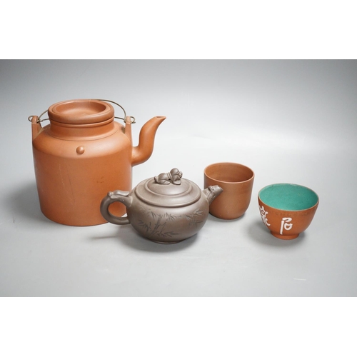 1315 - Two Chinese Yixing teapots and two similar teabowls. Tallest 14cm