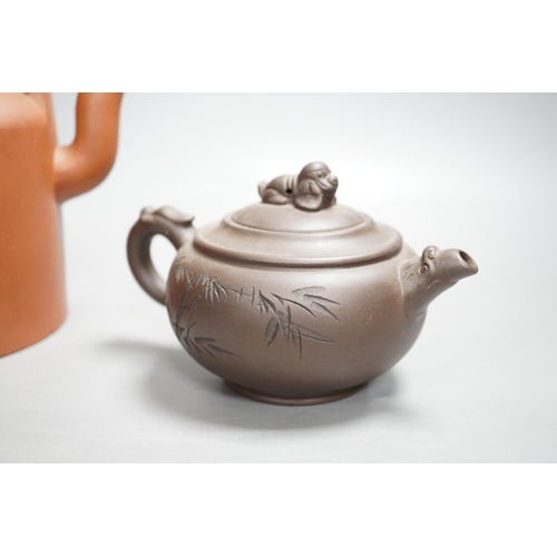 1315 - Two Chinese Yixing teapots and two similar teabowls. Tallest 14cm