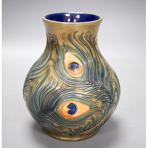 1321 - A Moorcroft pottery vase, decorated with the "Peacock feathers" pattern, 15.5cm