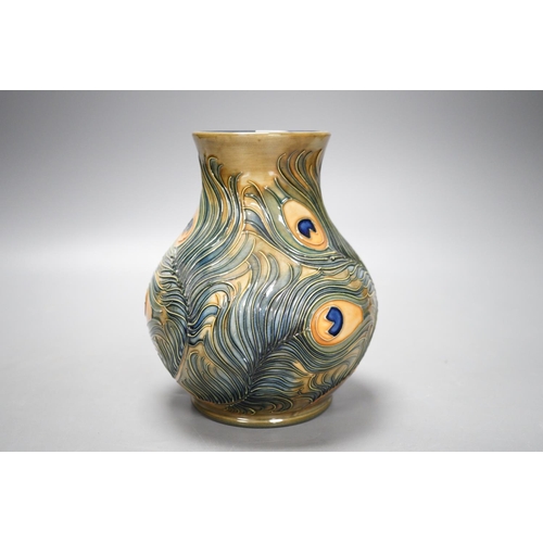 1321 - A Moorcroft pottery vase, decorated with the "Peacock feathers" pattern, 15.5cm