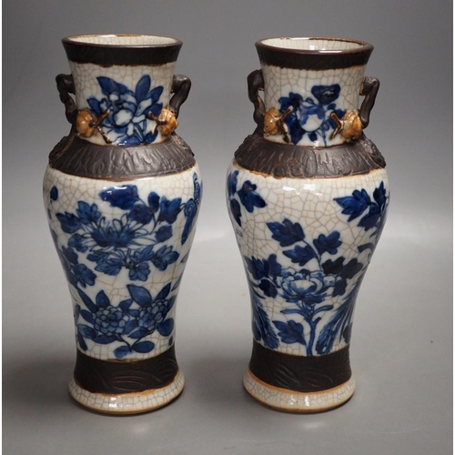 1327 - A pair of late 19th century Chinese blue and white crackle glaze vases, 21cm