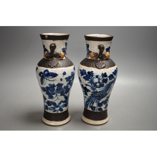 1327 - A pair of late 19th century Chinese blue and white crackle glaze vases, 21cm