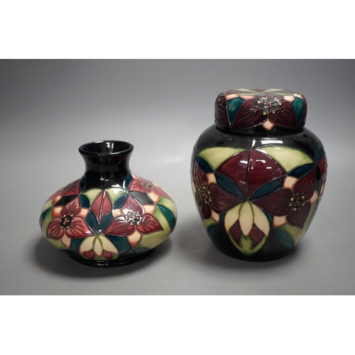 1328 - A Moorcroft pottery squat shaped vase and lidded ginger jar, decorated in the "Orchid Trillium&... 