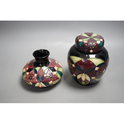 1328 - A Moorcroft pottery squat shaped vase and lidded ginger jar, decorated in the "Orchid Trillium&... 