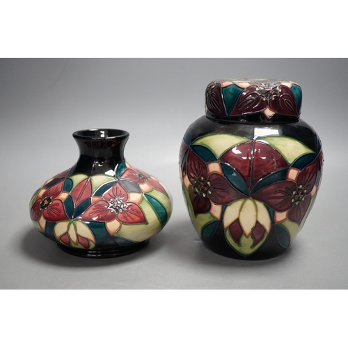 1328 - A Moorcroft pottery squat shaped vase and lidded ginger jar, decorated in the "Orchid Trillium&... 