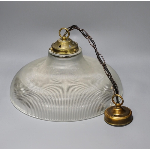 1331 - A clear ribbed glass shaded and brass pendant light,shade 37.5 cms diameter.