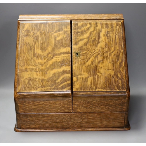 1340 - An Edwardian oak two door stationary box,36 cms high,