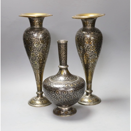 1343 - A pair of Indian damascened brass vases and a similar vase,pair of vases 33cms high,