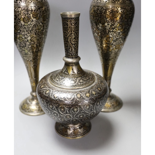 1343 - A pair of Indian damascened brass vases and a similar vase,pair of vases 33cms high,