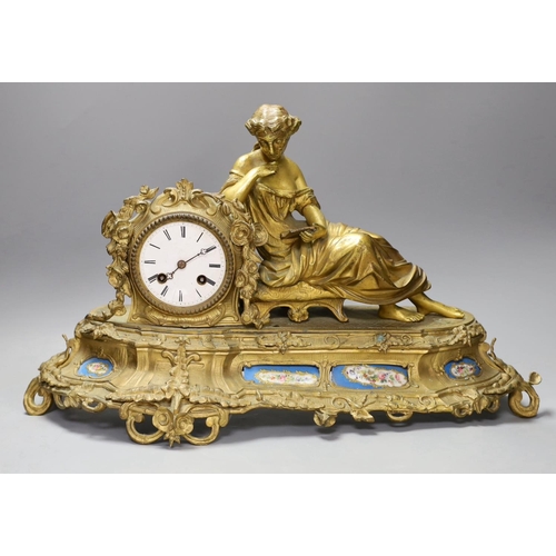 1344 - A 19th century French gilt metal figural mantel clock, with porcelain floral panels,30cms high.... 