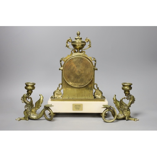 1353 - A 19th century French brass and alabaster mantel clock and a pair of dragon candlesticks,clock 28cms... 