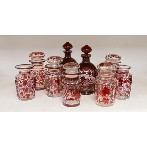 1354 - A pair of 19th century wheel engraved ruby glass decanters with stoppers, and seven ruby stained gla... 