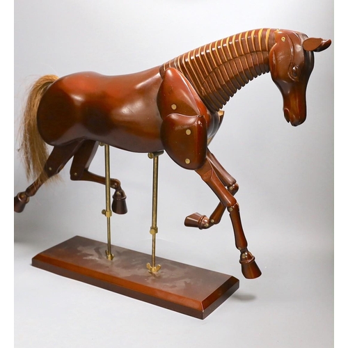 1361 - A modern artist's wooden articulated model of a horse, on stand,approx 51 cms wide x 46cms high,... 