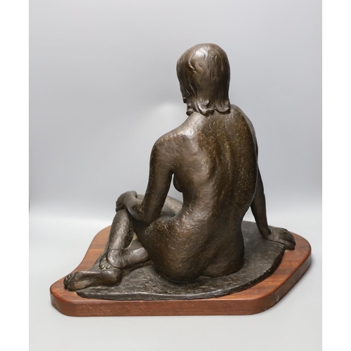 1365 - Audrey Shaw. A bronzed resin figure of a seated girl,43cm tall,