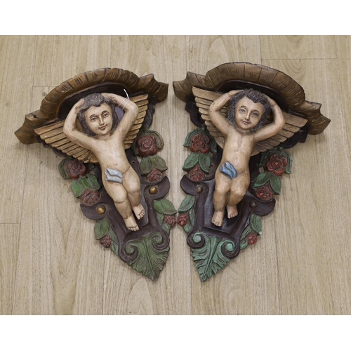 1378 - A pair of painted wooden cherubic wall brackets,42cm tall,