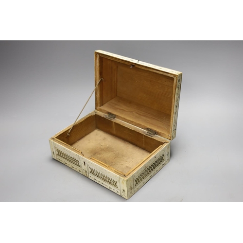 1387 - A 19th century prisoner of war fretted bone box, 21.5cm wide