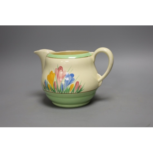 1397 - A Clarice Cliff crocus design milk jug and a Bizarre patterned side plate,jug 11.5 cms high,... 