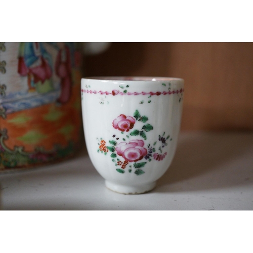 1398 - A Chinese famille rose teapot and cover, a blue and white prunus vase, a saucer and a coffee cup, 18... 