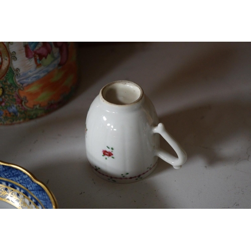 1398 - A Chinese famille rose teapot and cover, a blue and white prunus vase, a saucer and a coffee cup, 18... 