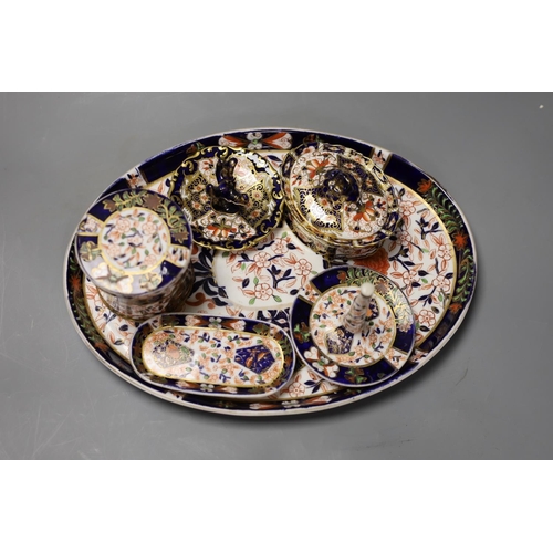 1403 - A collection of Royal Crown Derby and Crown Derby wares, including a cabaret tray, two ring stands, ... 