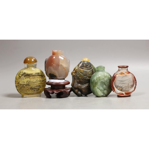 1410 - Five Chinese jade, glass and hardstone snuff bottles, the largest 7cm