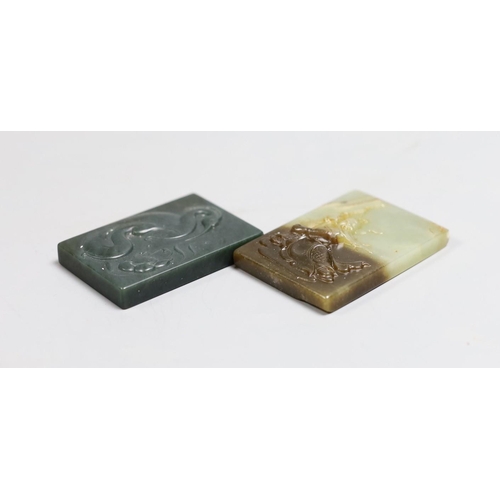 1412 - A Chinese russet and pale celadon jade plaque, 6.2cm and another green jade plaque