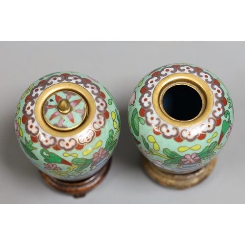 1415 - A pair of Chinese cloisonné enamel jars, wood stands, 9cm