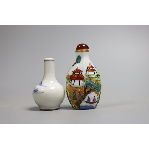 1429 - Two Chinese snuff bottles, to include a blue and white c.1900 bottle, and a famille rose bottle with... 