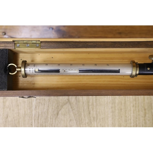 1452 - A 20th century marine barometer in a pine case,barometer 39 cms long,