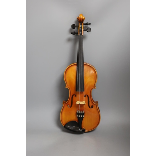 1453 - A cased child's violin and bow with ivorine tip, violin 55cms long,