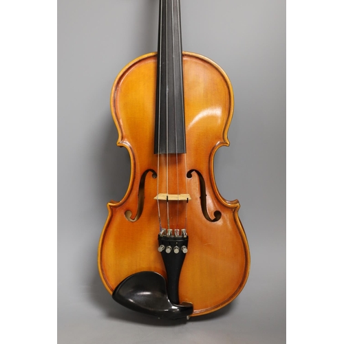 1453 - A cased child's violin and bow with ivorine tip, violin 55cms long,