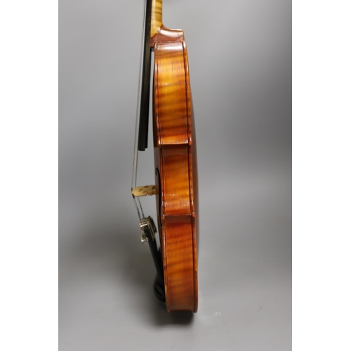 1453 - A cased child's violin and bow with ivorine tip, violin 55cms long,